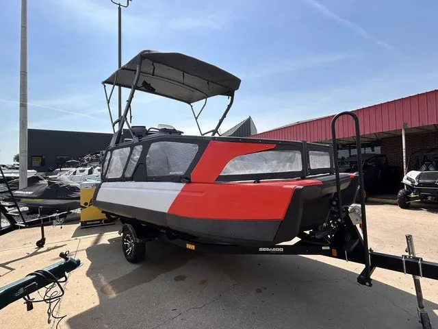 Slide: The Image of A 2022 Sea-Doo Switch Sport 18 on a trailer, featuring a red and black design. - 7