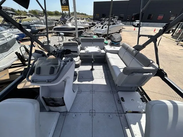 Slide: The Image of The image shows the spacious deck of a 2022 Sea-Doo Switch Sport 18 with gray seating. - 11
