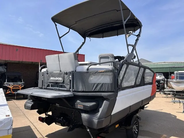 Slide: The Image of A 2022 Sea-Doo Switch Sport 18 with a gray canopy and modern design on a trailer. - 5
