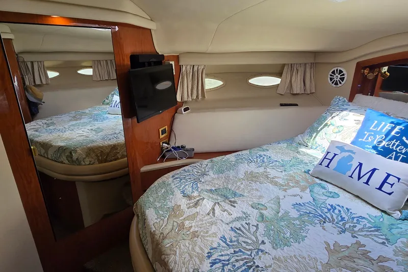 Slide: The Image of Luxurious cabin interior of 2000 Sea Ray 400 Sedan Bridge yacht with cozy bedding. - 36