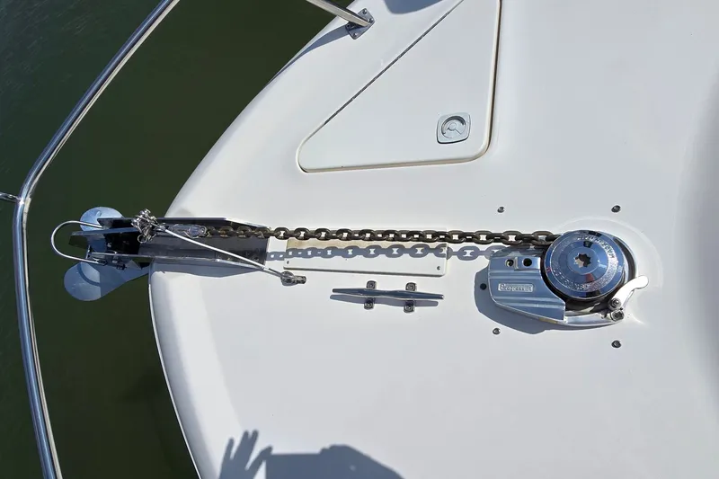 Slide: The Image of Anchor and chain mechanism on 2000 Sea Ray 400 Sedan Bridge yacht deck. - 7