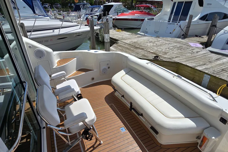Slide: The Image of 2000 Sea Ray 400 Sedan Bridge yacht with spacious seating and elegant deck design. - 17