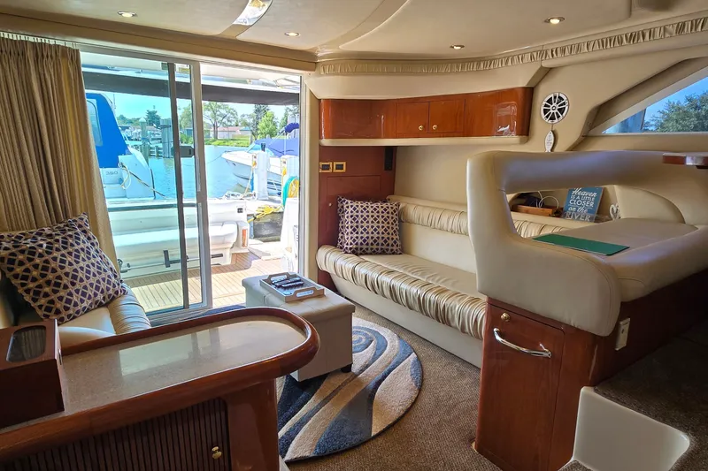 Slide: The Image of Luxurious interior of a 2000 Sea Ray 400 Sedan Bridge yacht with elegant seating. - 41