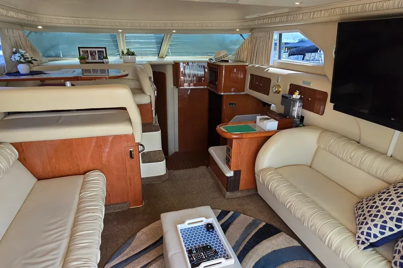 Slide: The Image of Luxurious interior of a 2000 Sea Ray 400 Sedan Bridge yacht with elegant seating and decor. - 22