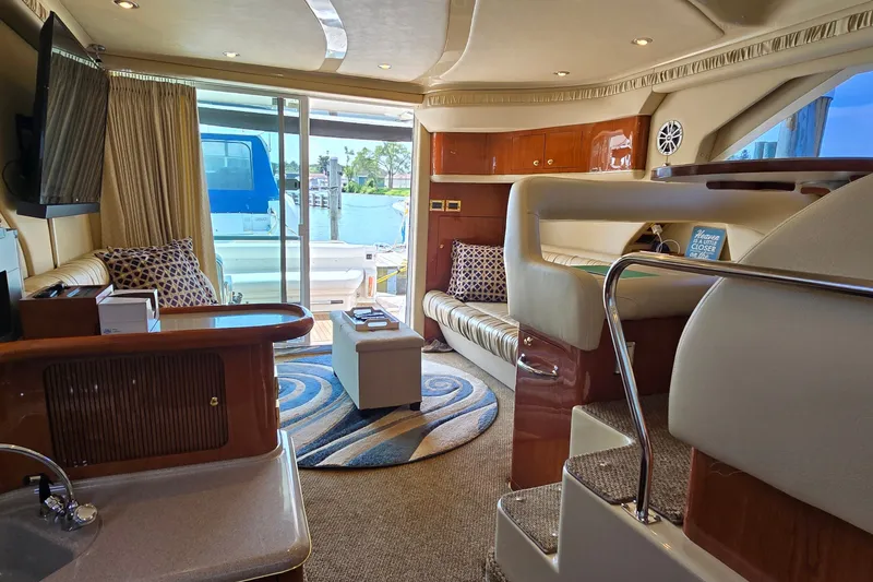 Slide: The Image of Luxurious interior of a 2000 Sea Ray 400 Sedan Bridge yacht with elegant furnishings. - 29