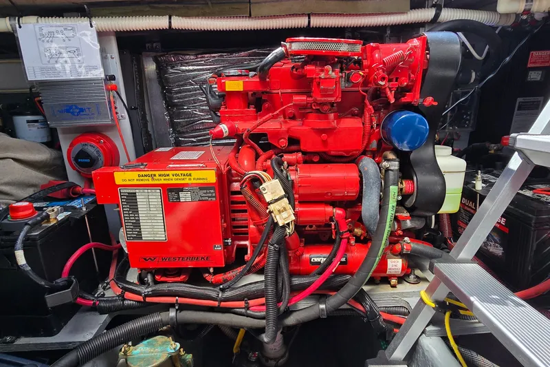 Slide: The Image of Engine room of a 2000 Sea Ray 400 Sedan Bridge with Westerbeke generator. - 43