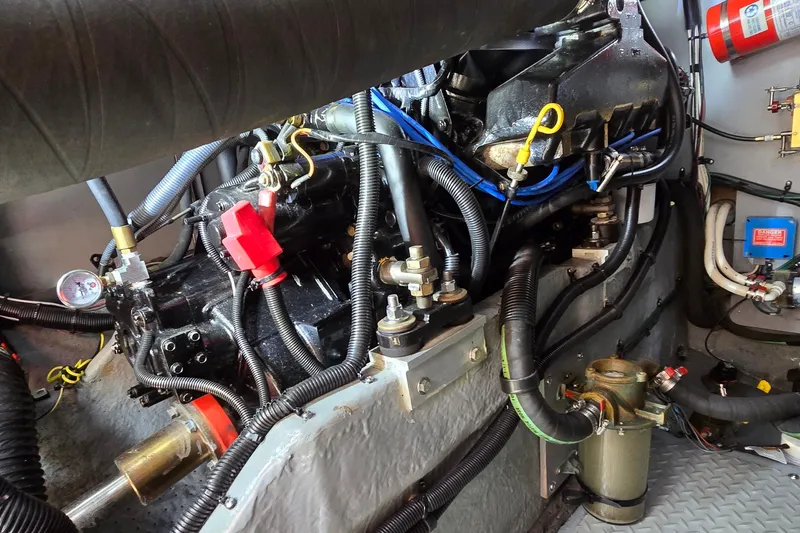 Slide: The Image of Engine compartment of a 2000 Sea Ray 400 Sedan Bridge with visible wiring and components. - 49