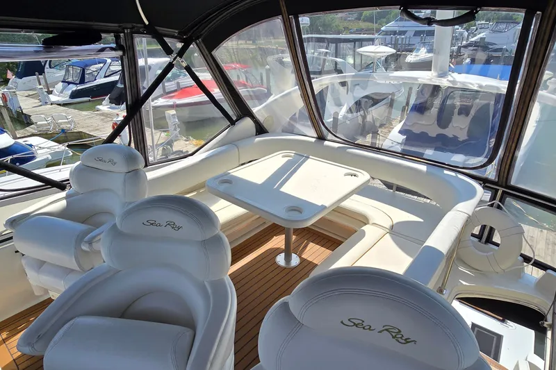 Slide: The Image of Luxurious interior of a 2000 Sea Ray 400 Sedan Bridge yacht with white seating. - 13