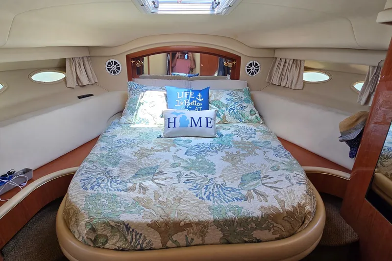 Slide: The Image of Cozy bedroom interior of 2000 Sea Ray 400 Sedan Bridge yacht with nautical decor. - 35
