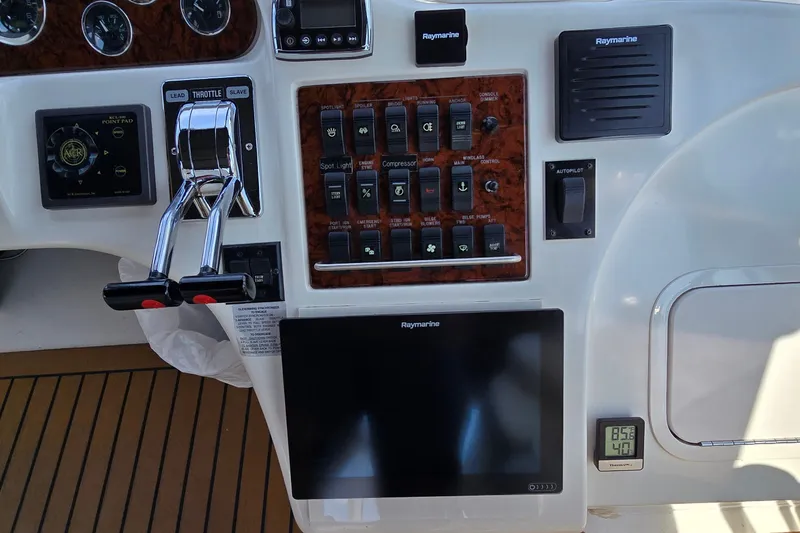Slide: The Image of Control panel of a 2000 Sea Ray 400 Sedan Bridge with Raymarine electronics. - 11