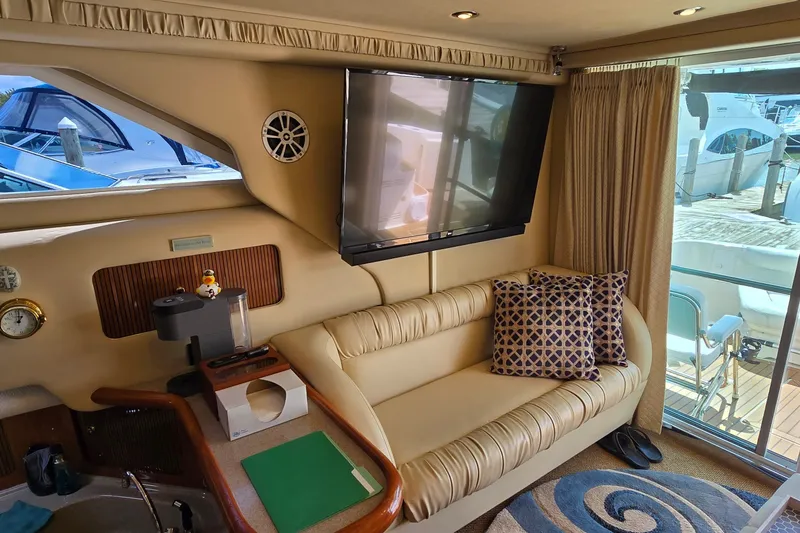 Slide: The Image of Luxurious interior of 2000 Sea Ray 400 Sedan Bridge yacht with plush seating and modern amenities. - 24