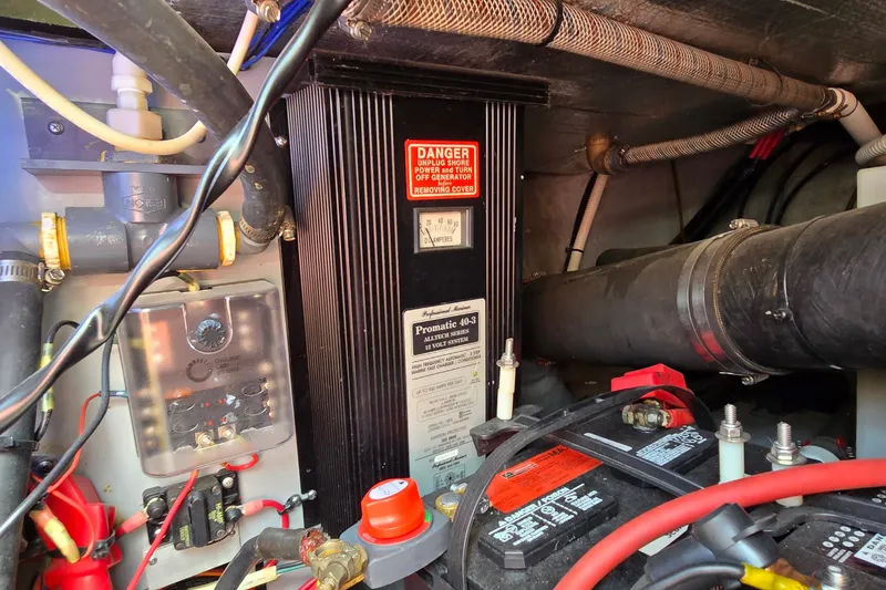 Slide: The Image of Engine room of 2000 Sea Ray 400 Sedan Bridge with electrical components and wiring. - 46