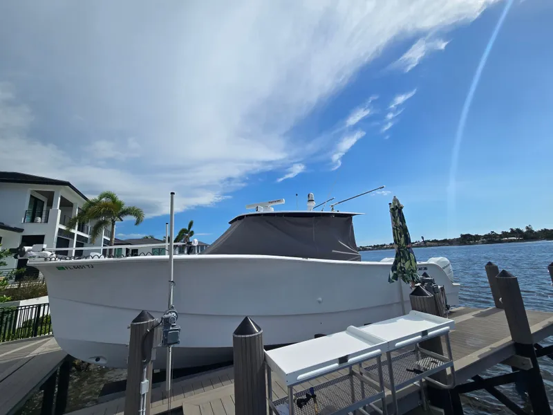 Slide: The Image of A modern 2023 Hammer Yachts 35 Cat is docked under a sunny sky. - 22