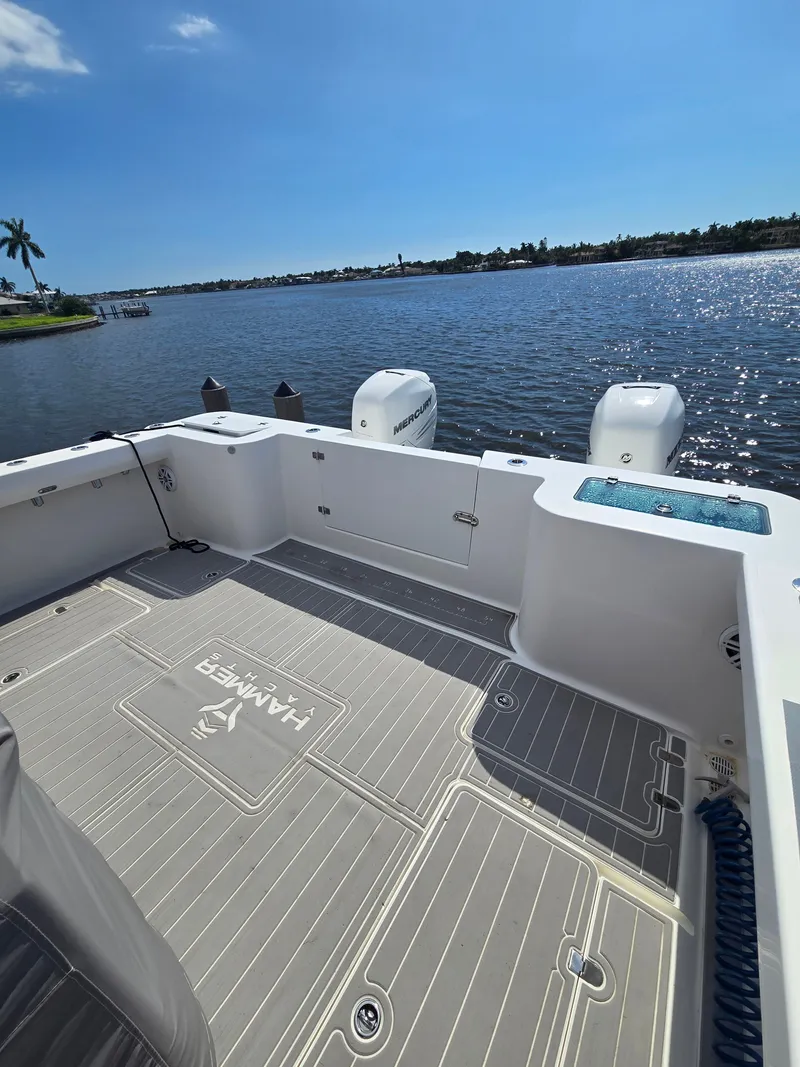 Slide: The Image of The deck of the 2023 Hammer Yachts 35 Cat offers a spacious area overlooking the water. - 6