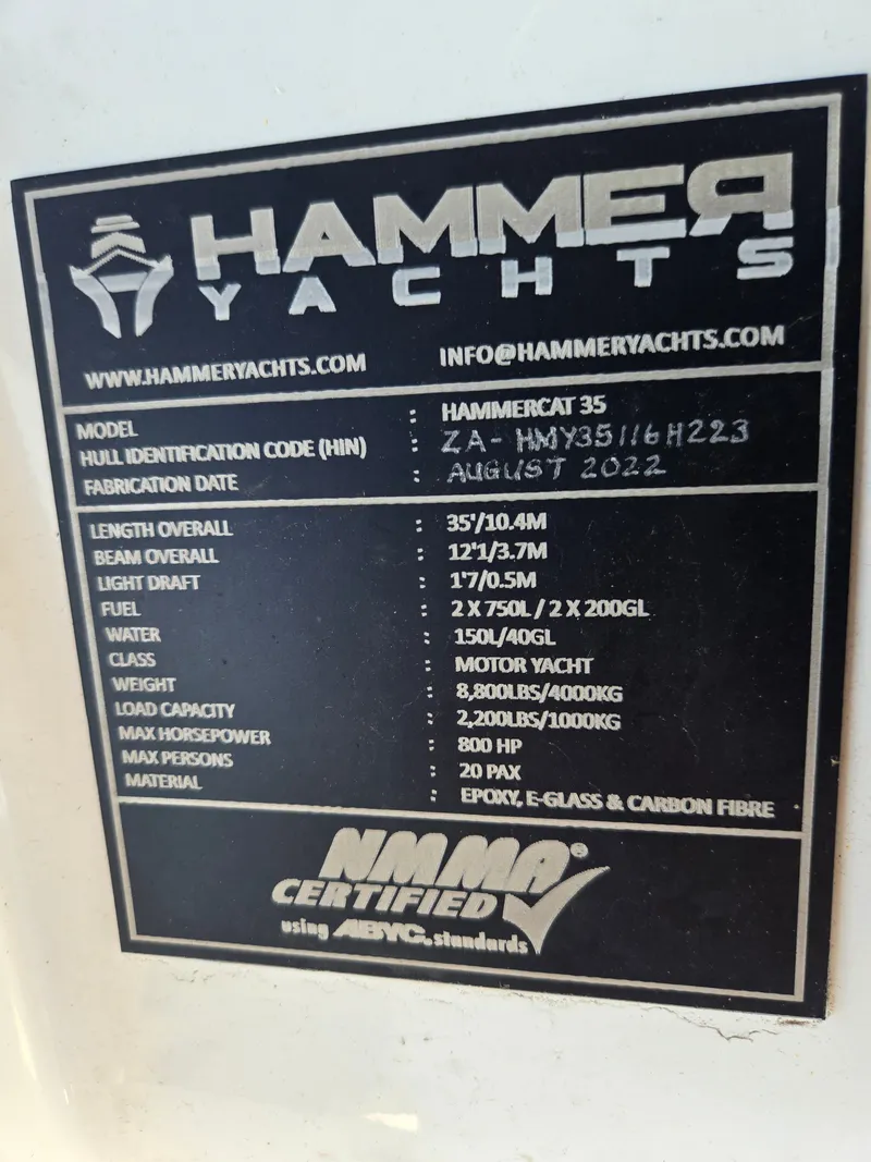 Slide: The Image of Hammer Yachts 35 Cat, 2023 model, with technical specifications on a plaque. - 18