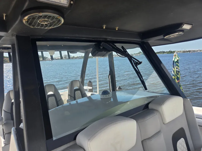 Slide: The Image of The image shows the cockpit of a 2023 Hammer Yachts 35 Cat with a view of the water. - 14
