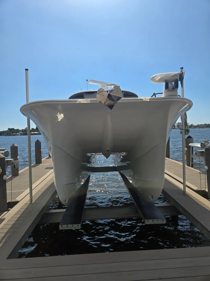 Slide: The Image of A 2023 Hammer Yachts 35 Cat is docked. The catamaran features a sleek, modern design. - 9