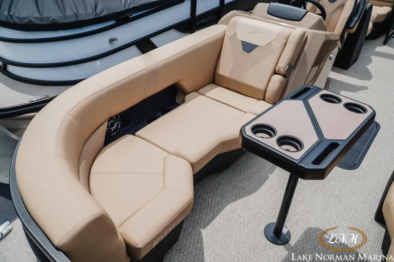 Slide: The Image of Luxurious seating area on 2027 Evotti 523QL boat with cup holders and table. - 15