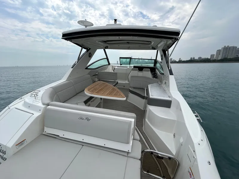 Slide: The Image of The image shows a 2023 Sea Ray Sundancer 320 with a sleek, modern design. - 16