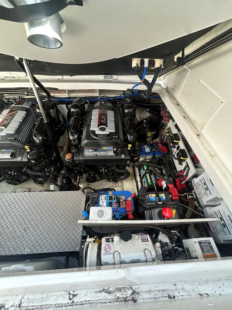 Slide: The Image of Engine compartment of a Sea Ray Sundancer 320 with two engines and batteries. - 23