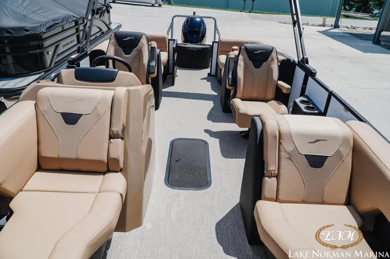 Slide: The Image of Luxurious 2027 Evotti 521QL boat interior with beige seating at Lake Norman Marina. - 14