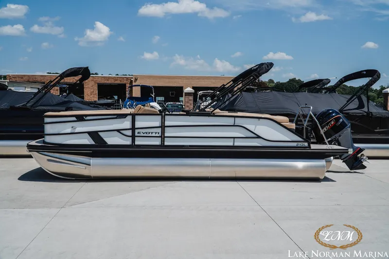 The Image of 2027 Evotti 521QL pontoon boat at Lake Norman Marina under clear blue sky. - 1