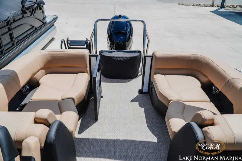 Slide: The Image of Luxurious 2027 Evotti 521QL pontoon boat interior with plush seating at Lake Norman Marina. - 18