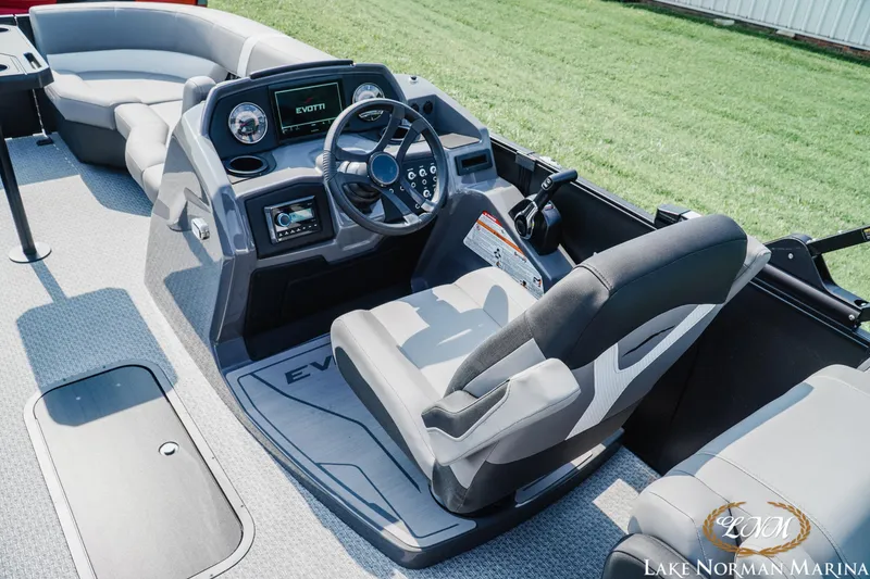 Slide: The Image of Interior of 2027 Evotti 521QL boat with modern dashboard and seating at Lake Norman Marina. - 9