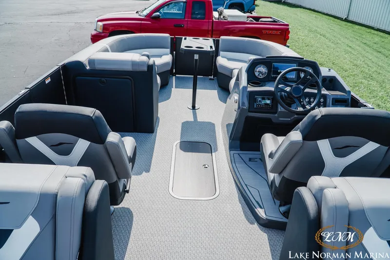 Slide: The Image of Interior of 2027 Evotti 521QL pontoon boat with luxurious seating and modern dashboard. - 8