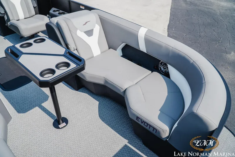 Slide: The Image of Luxurious seating area on 2027 Evotti 521QL boat with cupholders and table. - 16