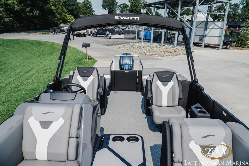 Slide: The Image of 2027 Evotti 521QL boat interior at Lake Norman Marina, featuring modern seating and design. - 13