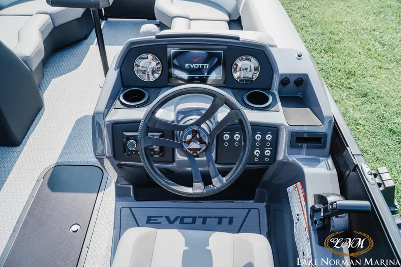 Slide: The Image of Cockpit of 2027 Evotti 521QL boat with modern steering and controls. - 10