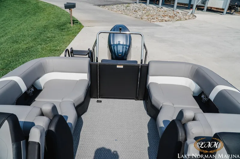 Slide: The Image of Luxurious 2027 Evotti 521QL pontoon boat interior with plush seating at Lake Norman Marina. - 18