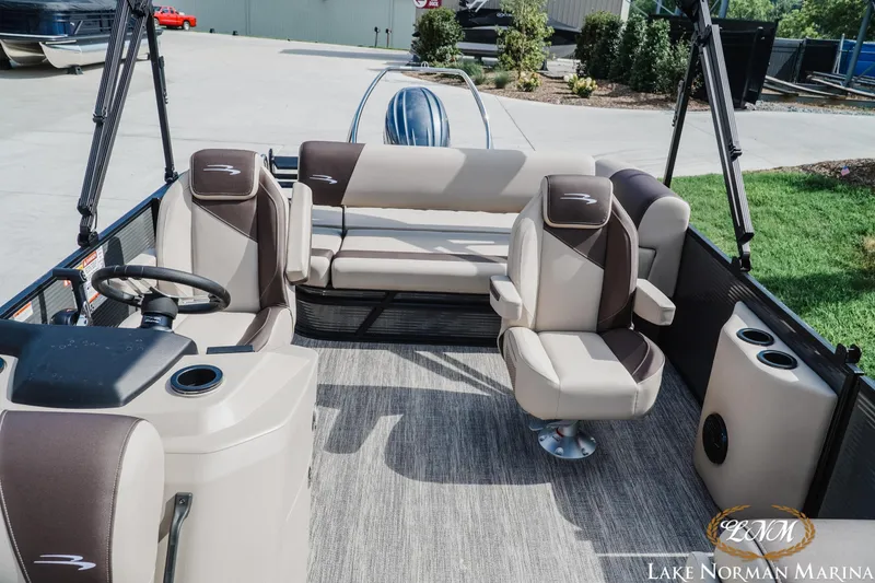 Slide: The Image of 2027 Bennington 22SSB pontoon boat interior with plush seating at Lake Norman Marina. - 15