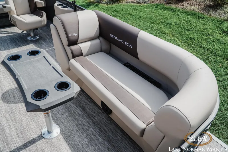 Slide: The Image of Luxurious seating on 2027 Bennington 22SSB pontoon boat with cup holders and table. - 14