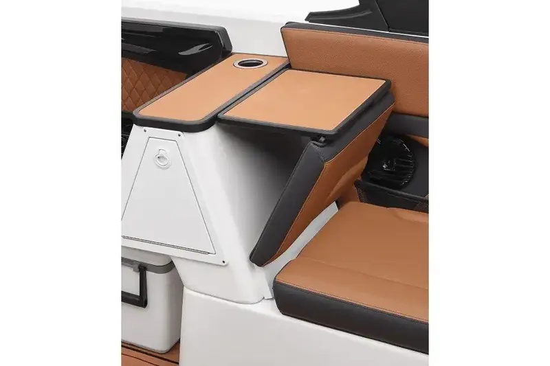 Slide: The Image of Manufacturer Provided Image: 2027 Yamaha Boats 252SD interior with tan and black seating, featuring a foldable table. - 3