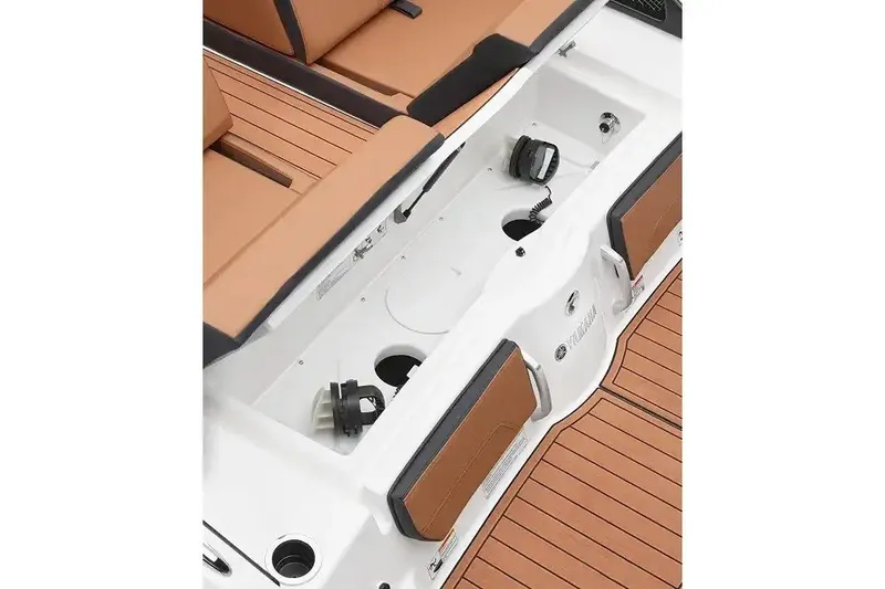 Slide: The Image of Manufacturer Provided Image: 2027 Yamaha Boats 252SD interior with tan seating and storage compartments. - 2