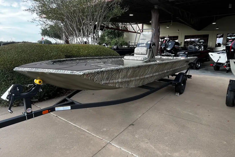 The Image of 2027 Tracker Grizzly 1860 CC boat on trailer, displayed outdoors. - 0