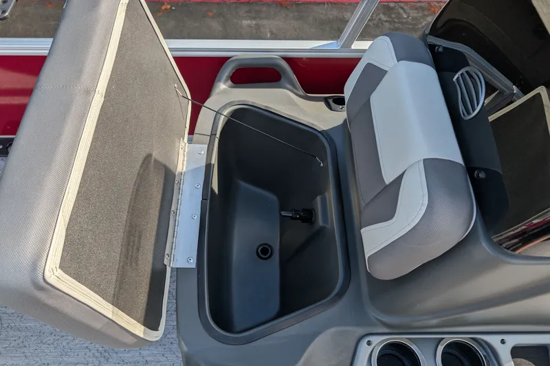 Slide: The Image of 2027 Sun Tracker Bass Buggy 16 XL Select boat seat storage compartment, open view. - 14