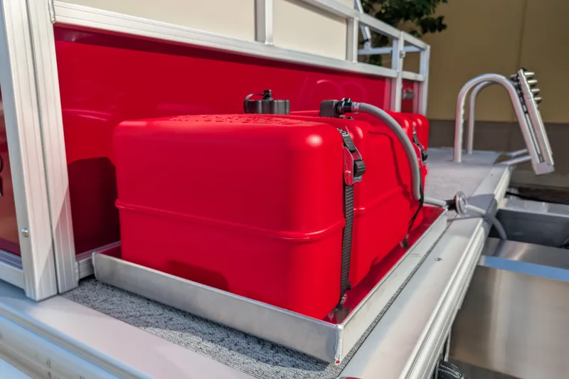 Slide: The Image of Red fuel tank on 2027 Sun Tracker Bass Buggy 16 XL Select pontoon boat. - 16