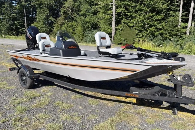 The Image of 2027 Tracker Bass Tracker Classic Limited boat on trailer, parked outdoors. - 0