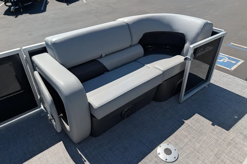Slide: The Image of 2027 Sun Tracker Party Barge 22 RF DLX with gray seating and cup holders on deck. - 13
