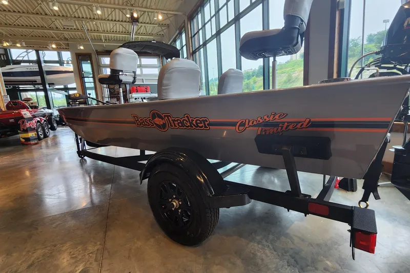 The Image of 2027 Tracker Bass Tracker Classic Limited boat displayed indoors on a trailer. - 0