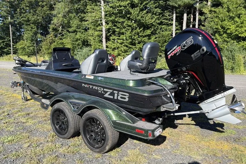 Slide: The Image of 2027 Nitro Z18 XL boat with Mercury Pro XS 150 engine, parked outdoors. - 1