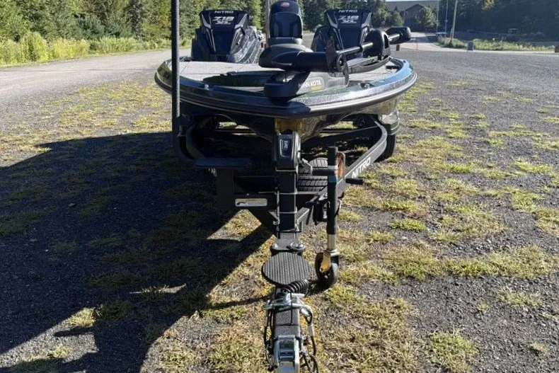 Slide: The Image of 2027 Nitro Z18 XL boat on trailer in outdoor setting. - 2