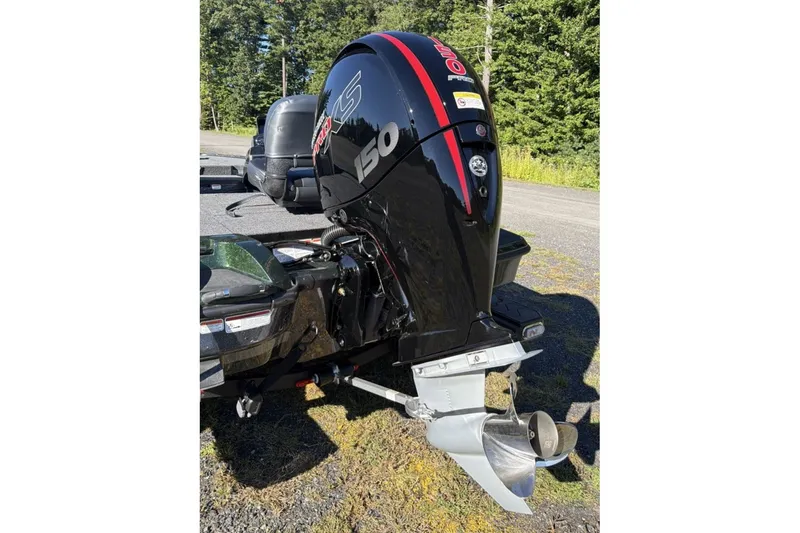 Slide: The Image of 2027 Nitro Z18 XL boat engine, black with red accents, parked outdoors. - 4