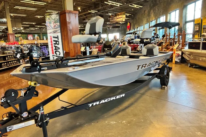 The Image of 2027 Tracker Pro 170 fishing boat displayed in a showroom, featuring modern design and equipment. - 0