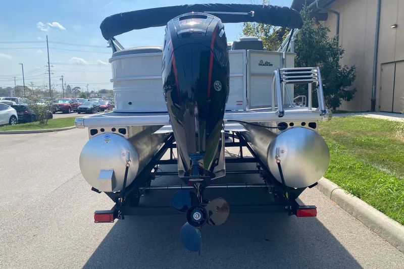 Slide: The Image of 2027 Sun Tracker Party Barge 20 DLX pontoon boat on trailer, rear view. - 12