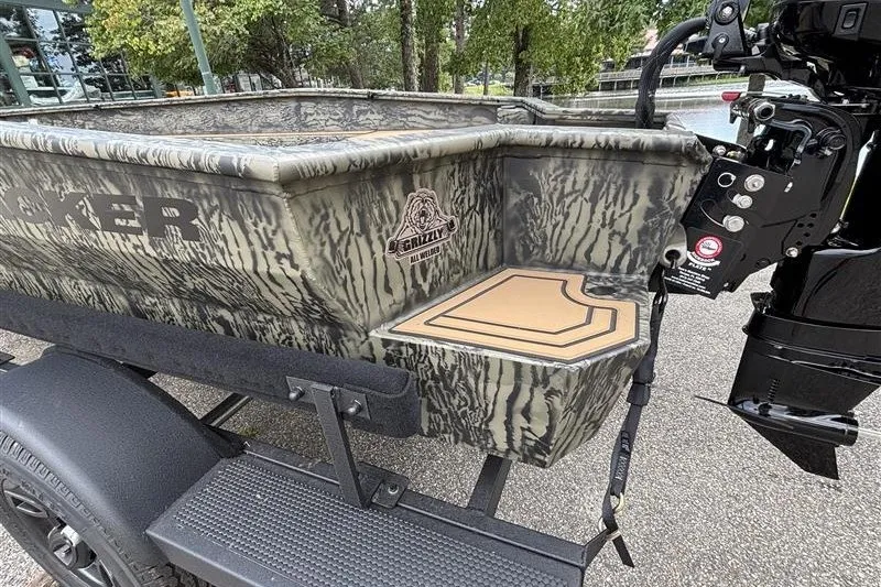 Slide: The Image of 2027 Tracker Grizzly 1650 T Prairie Wings Edition boat with camouflage design and motor. - 15