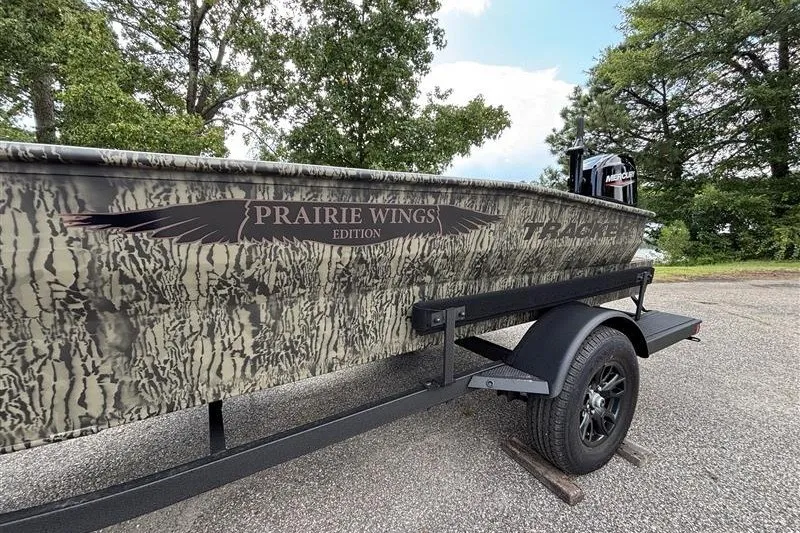 Slide: The Image of 2027 Tracker Grizzly 1650 T Prairie Wings Edition boat on trailer, camo design. - 16